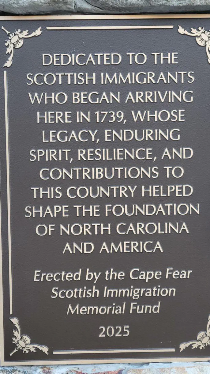 Memorial cairn dedication plaque